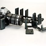 Trzy uchwyty do Olympusa OM-D E-M5, każdy robiony przez innego, niezależnego producenta.