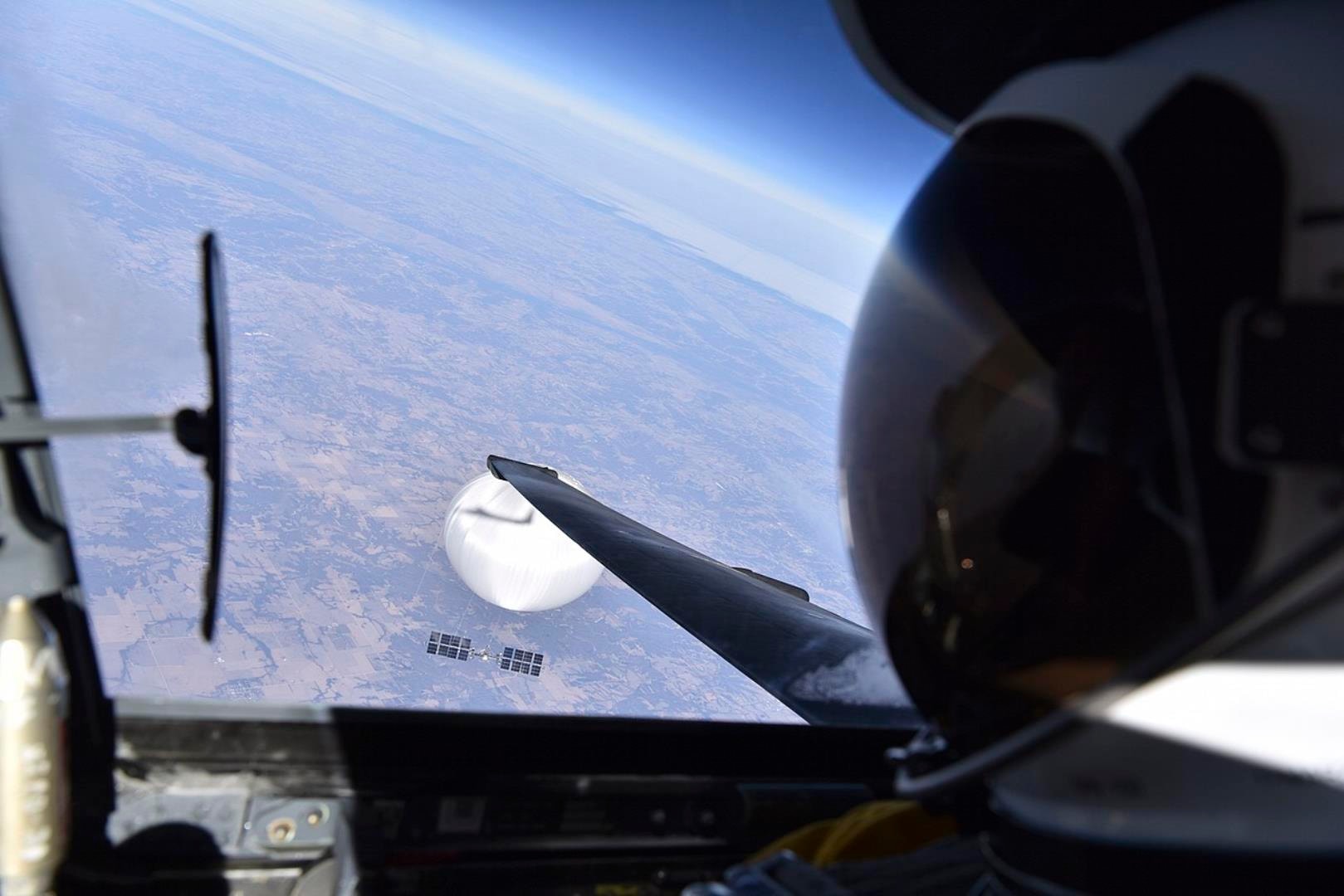 A U.S. Air Force pilot looked down at the suspected Chinese surveillance balloon as it hovered over the Central Continental United States February 3, 2023. Recovery efforts began shortly after the balloon was downed. (Photo courtesy of the Department of Defense)
