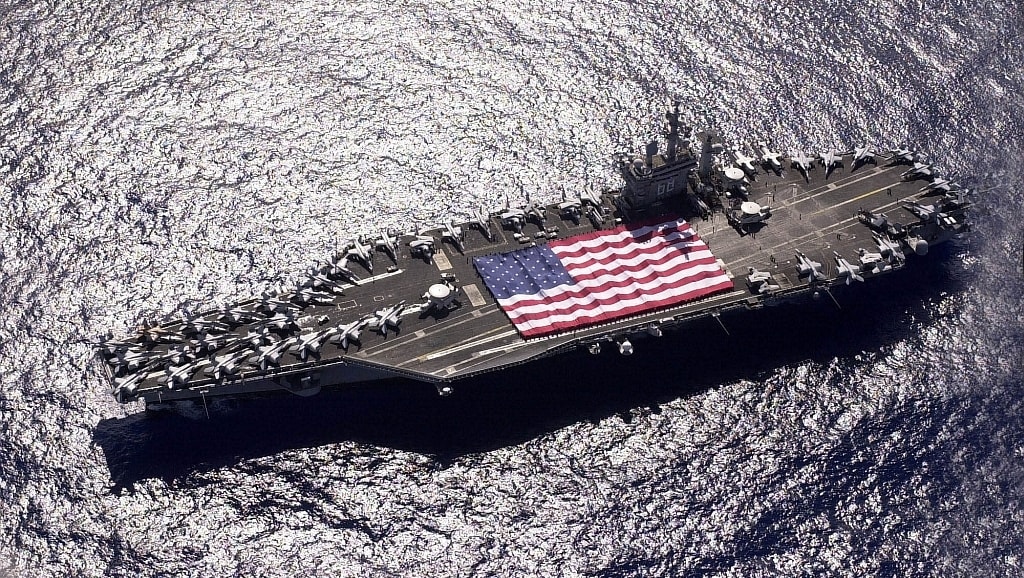 031103-N-6536T-006
Pacific Ocean (Nov. 3, 2003) &#8212; USS Nimitz (CVN 68) and Carrier Air Wing Eleven (CVW-11) personnel participate in a flag unfurling rehearsal on the shipÕs flight deck during Tiger Cruise with the help of fellow tigers.  The Nimitz Carrier Strike Group and embarked CVW-11 are en route to San Diego, Calif., following an eight-month deployment to the Arabian Gulf in support of Operation Iraqi Freedom.  U.S. Navy photo by PhotographerÕs Mate 3rd Class Elizabeth Thompson.  (RELEASED)
