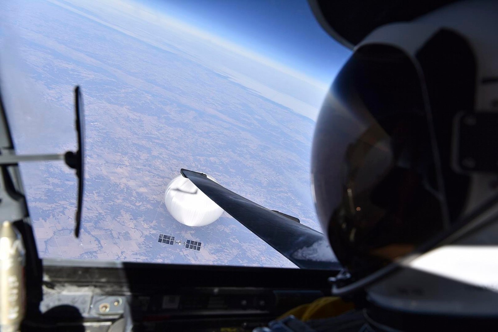 A U.S. Air Force pilot looked down at the suspected Chinese surveillance balloon as it hovered over the Central Continental United States February 3, 2023. Recovery efforts began shortly after the balloon was downed. (Photo courtesy of the Department of Defense)

