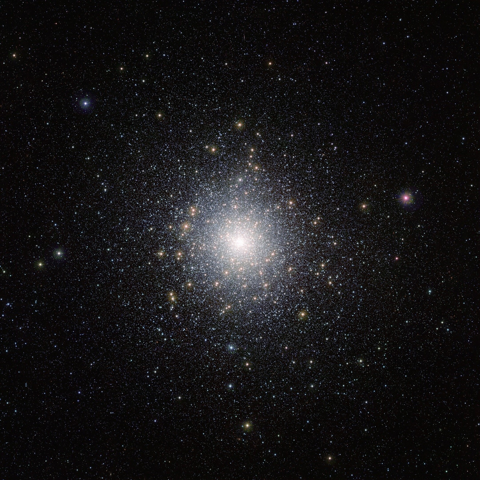 This bright cluster of stars is 47 Tucanae (NGC 104), shown here in an image taken by ESO’s VISTA (Visible and Infrared Survey Telescope for Astronomy) from the Paranal Observatory in Chile. This cluster is located around 15 000 light-years away from us and contains millions of stars, some of which are unusual and exotic. This image was taken as part of the VISTA Magellanic Cloud survey, a project that is scanning the region of the Magellanic Clouds, two small galaxies that are very close to our Milky Way.
